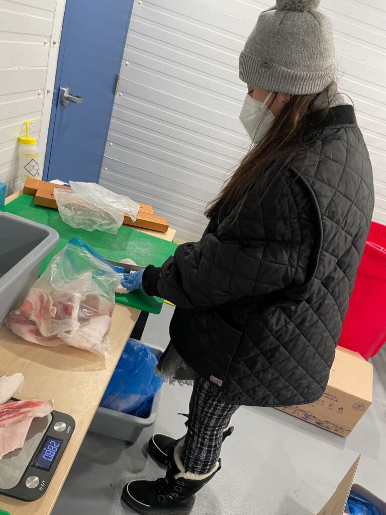 PPO applications team member cutting chicken