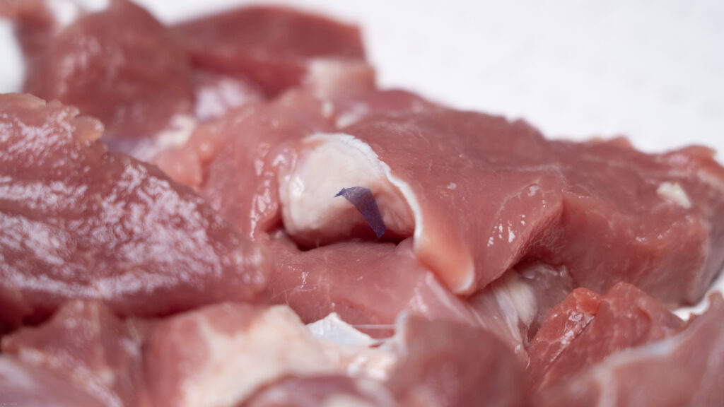 Plastic on Raw Pork